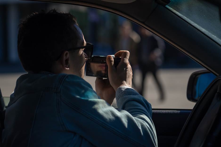 Man filming inside his car using his phone